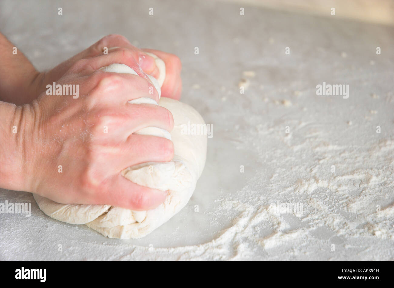 Hands kneading dough Stock Photo - Alamy
