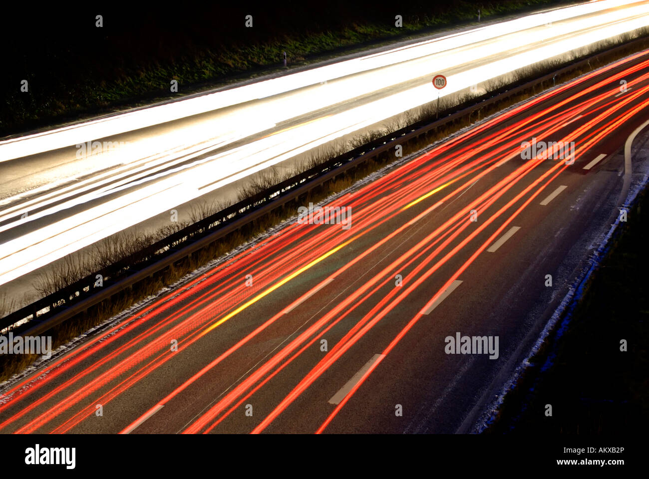 Blurred headlights during the vespertine rush hour traffic Stock Photo