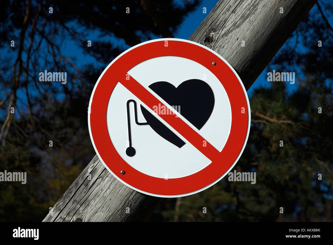 Warning sign for poeple with cardiac pacemakers near a radio tower Stock Photo