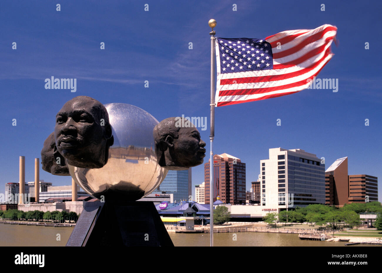 Rev Martin Luther King sculpture on the Martin Luther King Memorial Bridge over the Maumee River skyline of Toledo Ohio Stock Photo