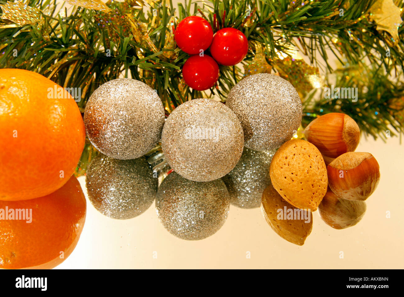 Christmas decoration and nuts on a mirror Stock Photo