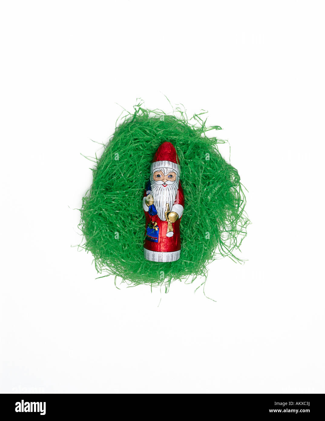 Chocolate Santa Claus lying in an Easter nest Stock Photo