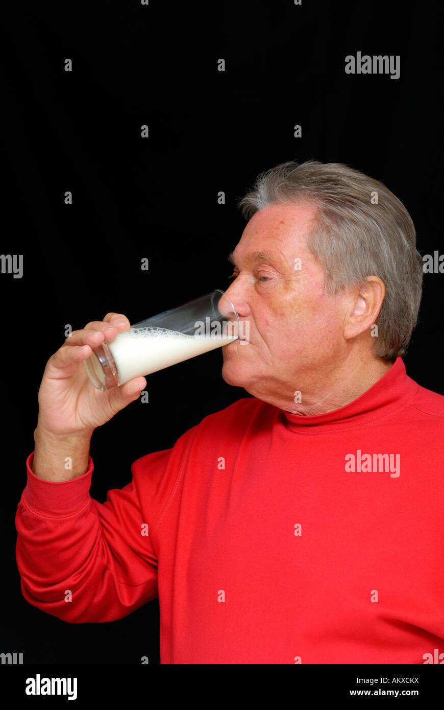 Senior is drinking a glas of milk Stock Photo Alamy