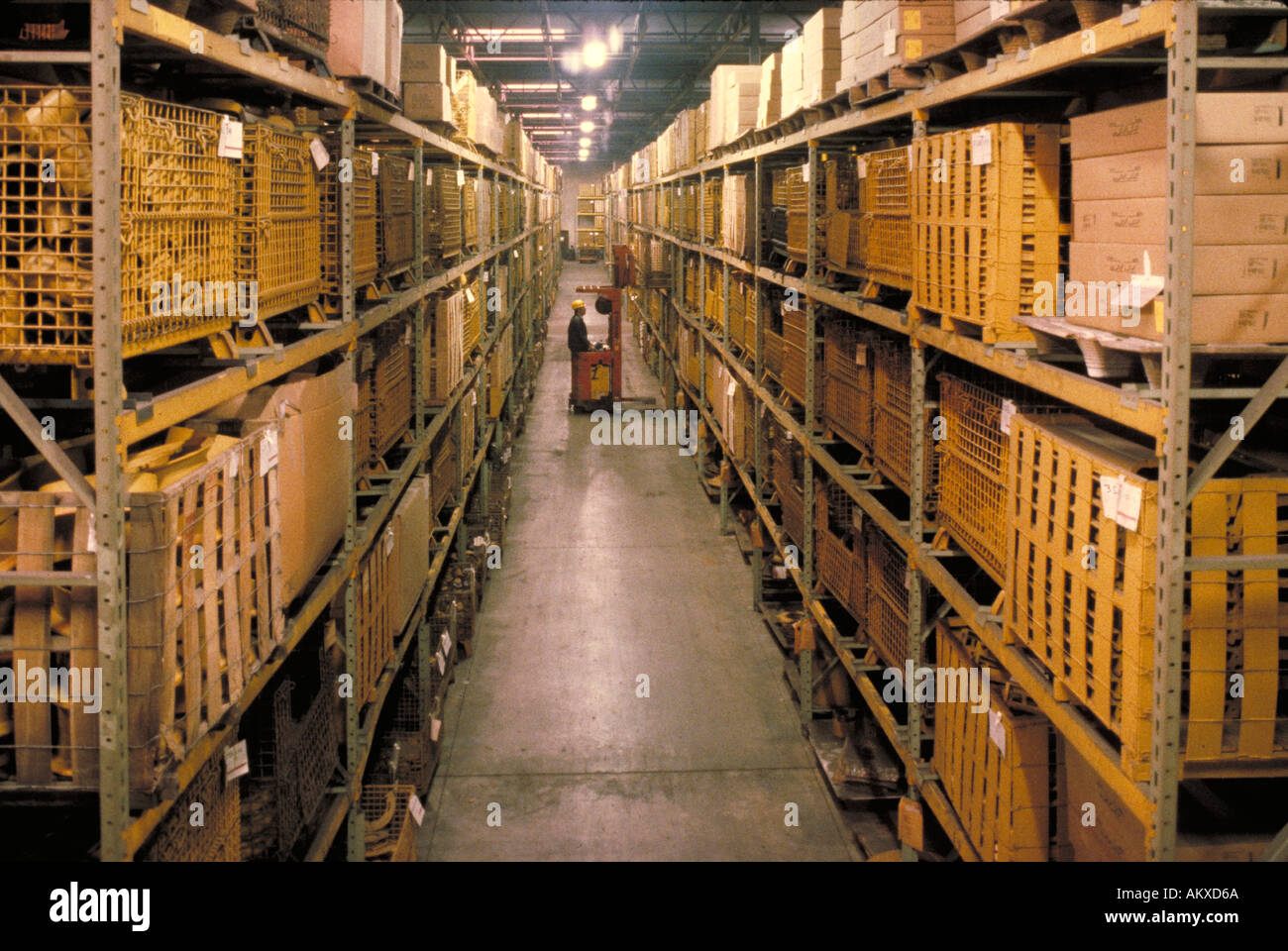 Man operating forklift in warehouse area of steel fabrication plant