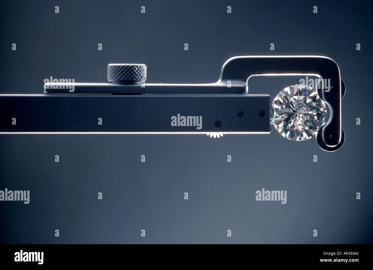 A cut and diamond held in an inspection tool Stock Photo Alamy