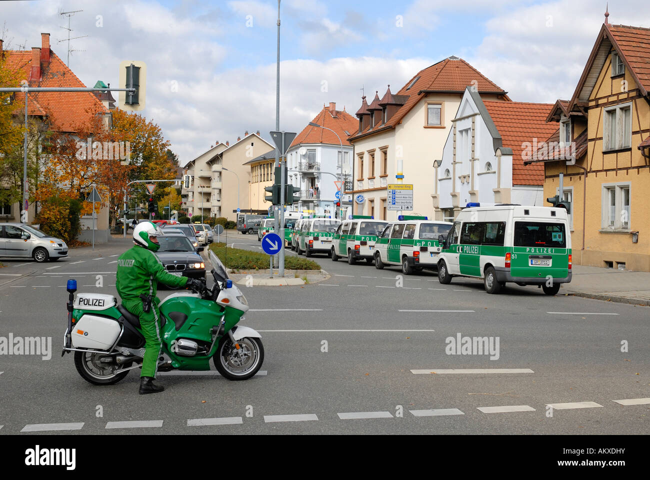 Personal carrier and a policeman on a motorbike during a demonstration - Baden Wuerttemberg, Germany, Europe. Stock Photo