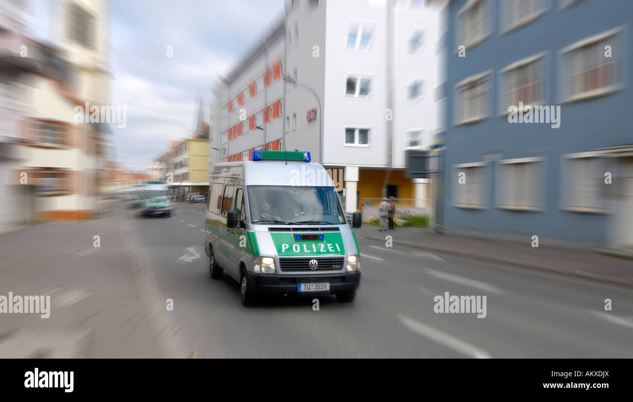 A convoy of police carrier driving speedily by the city - Baden Wuerttemberg, Germany, Europe. Stock Photo