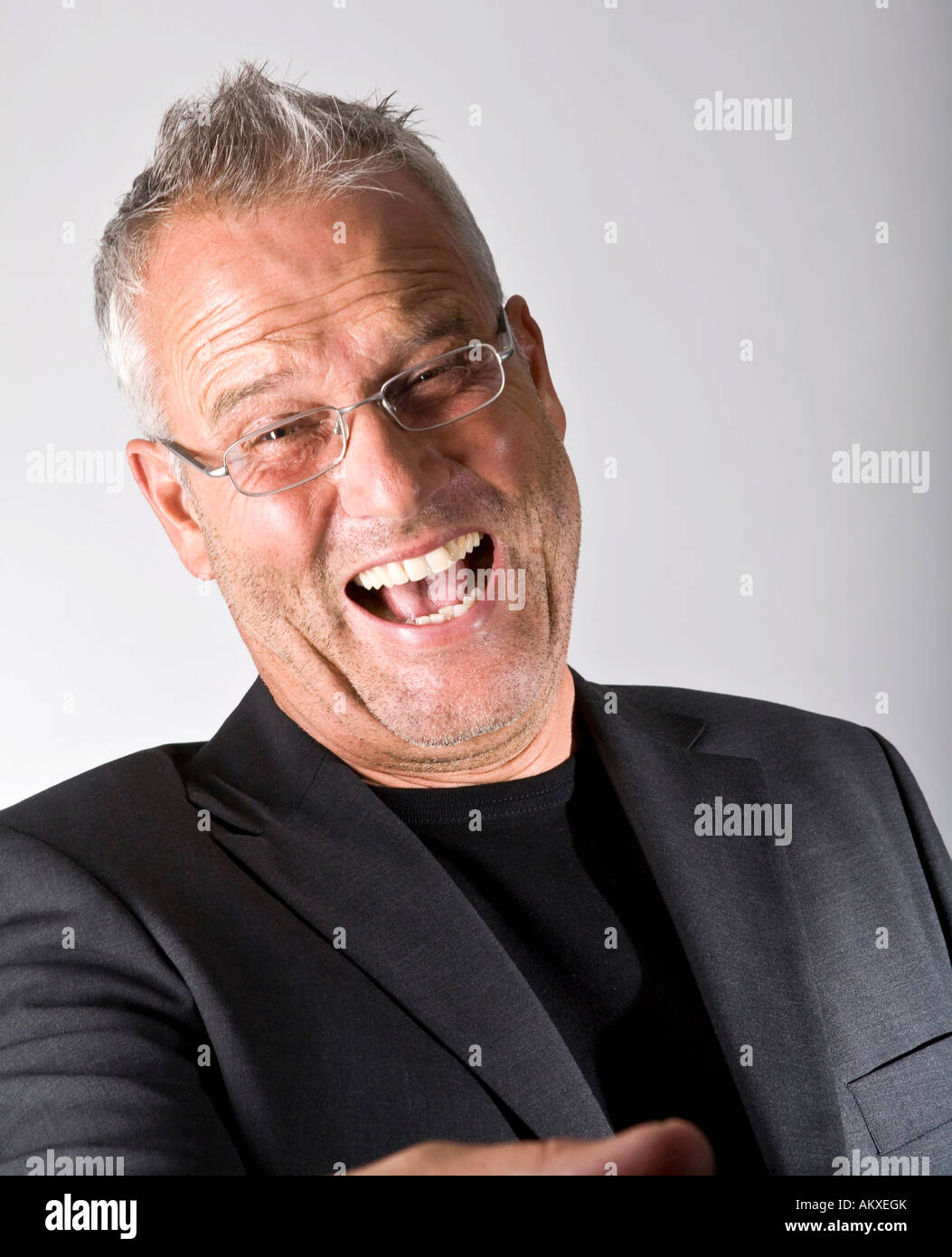 Portrait of a laughing business man with eyeglasses Stock Photo