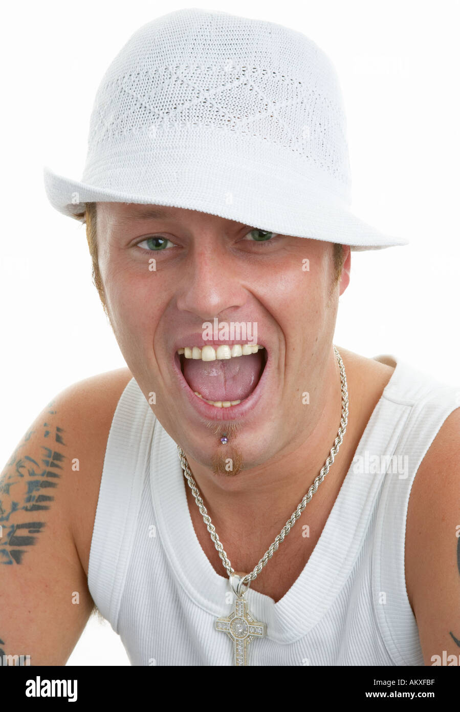 Smiling thirties guy in white hate shouting Stock Photo