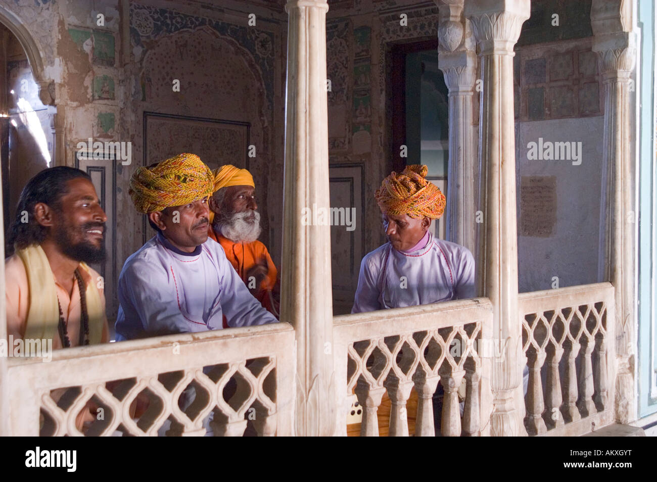 Rajasthani musicians perform in the main dining room of the old palace of Bhadrawati in Bhandarej, Rajasthan, India. - Stock Image