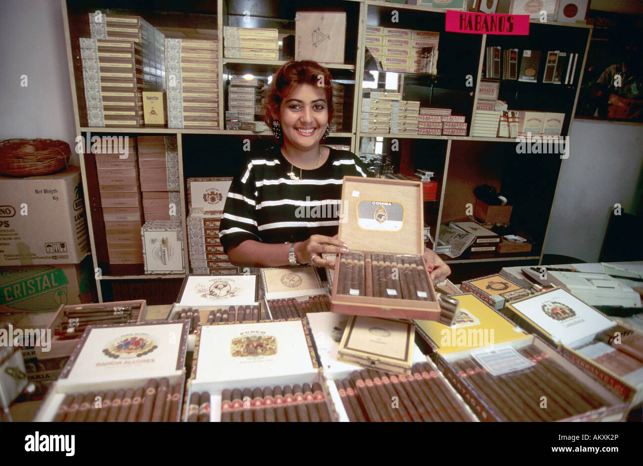 Cigar factory shop assistant presents Cuban cigars, Santiago de Cuba, Cuba Stock Photo