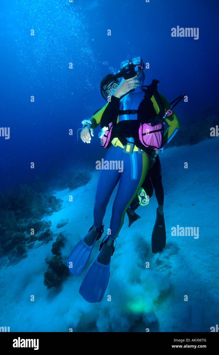 Rescue and emergency rise of an unsuccessful diver by a rescue diver. Stock Photo