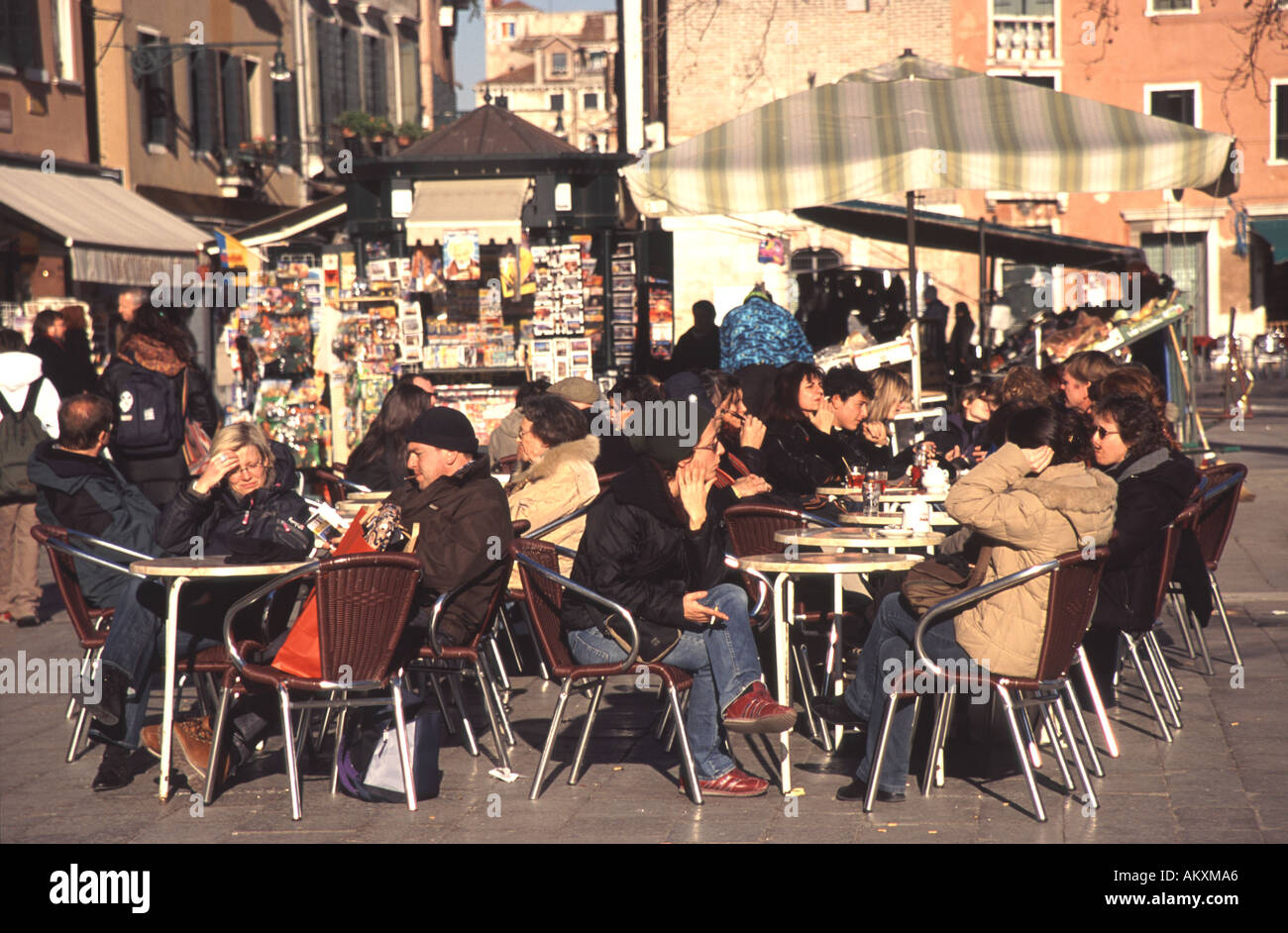 VENICE, ITALY. People enjoying the winter sun on Campo Santa Margherita in Dorsoduro. Stock Photo