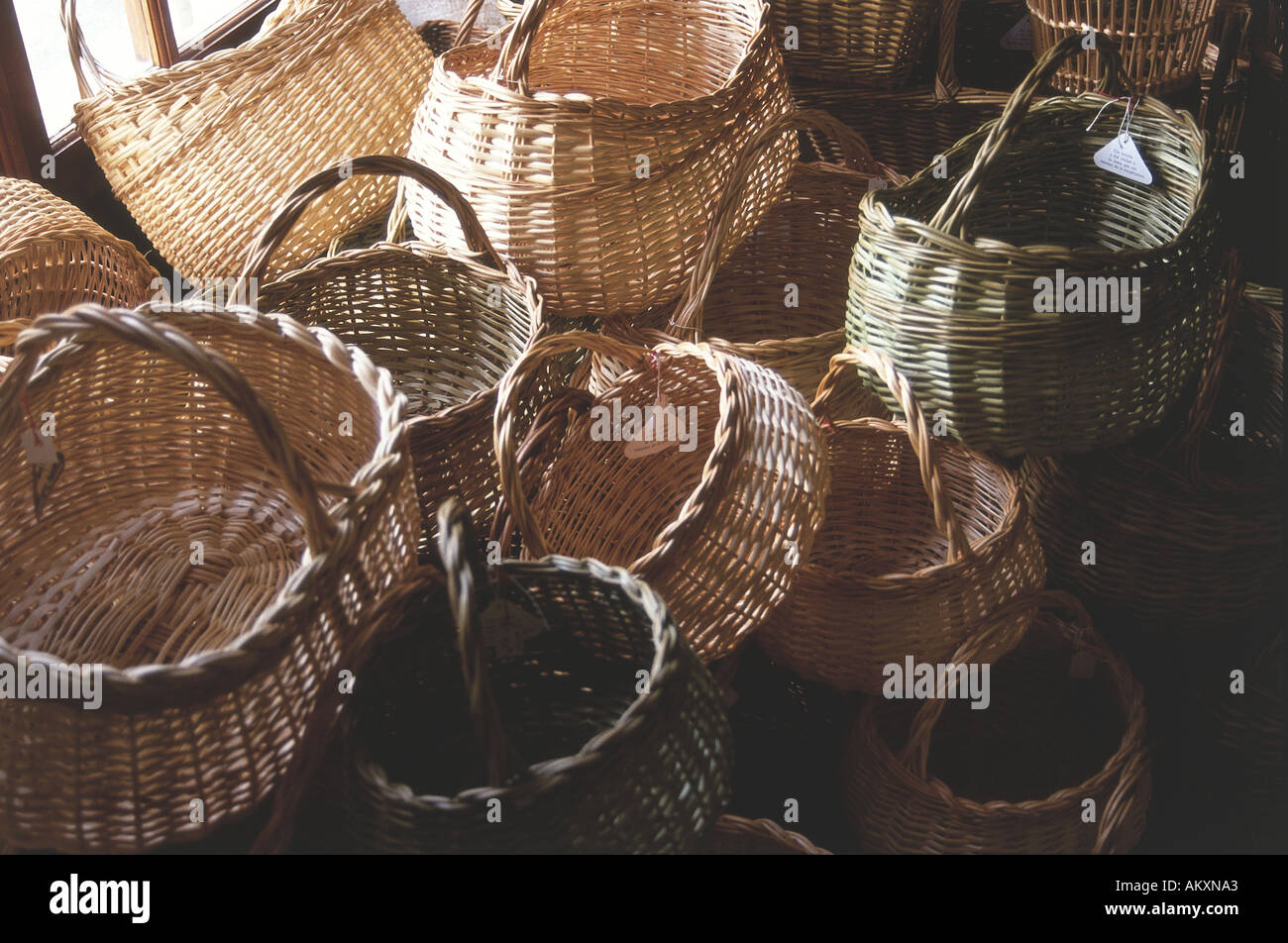 A mound of wicker baskets of different shapes and sizes for sale in a