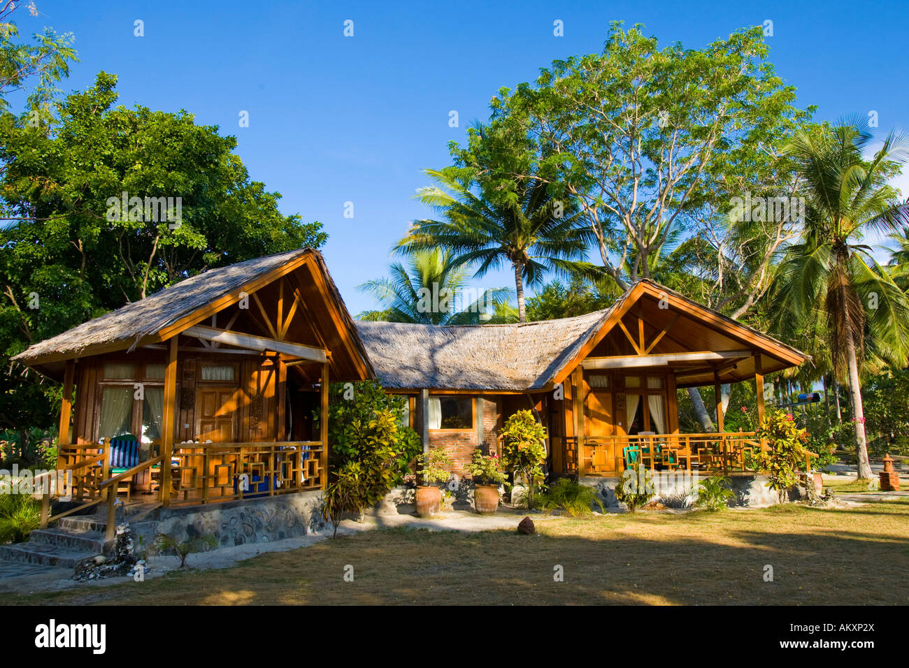 Gangga Island, Bungalows, island with a hotel in the north of Sulawesi, Indonesia. Stock Photo
