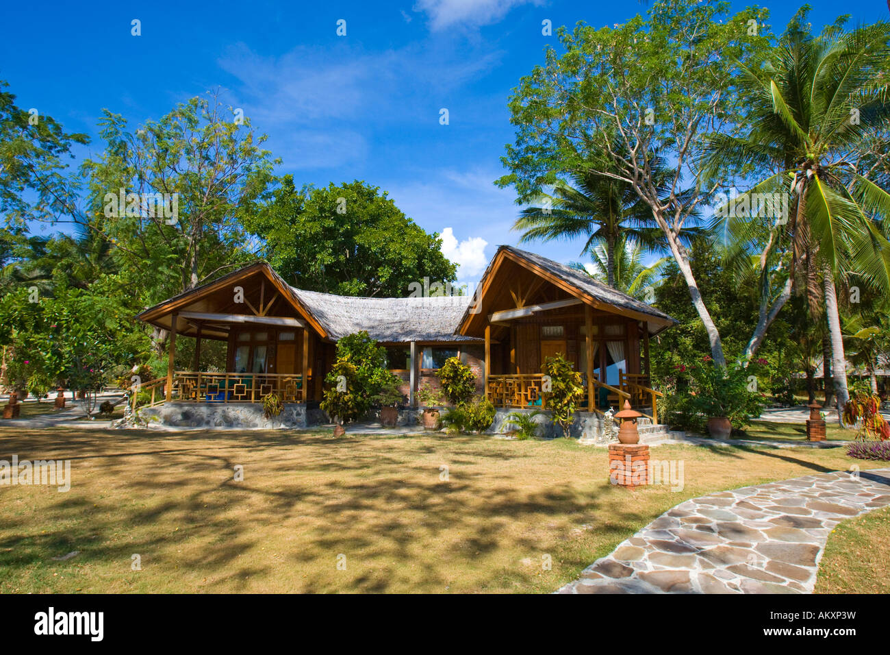 Gangga Island, Bungalows, island with a hotel in the north of Sulawesi, Indonesia. Stock Photo