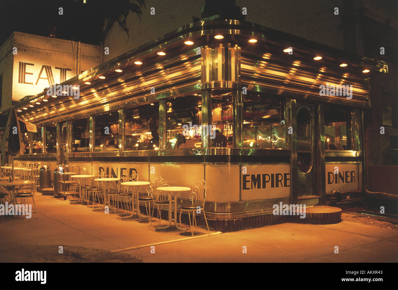 Empty tables on the pavement outside the Empire Diner New York USA Stock Photo
