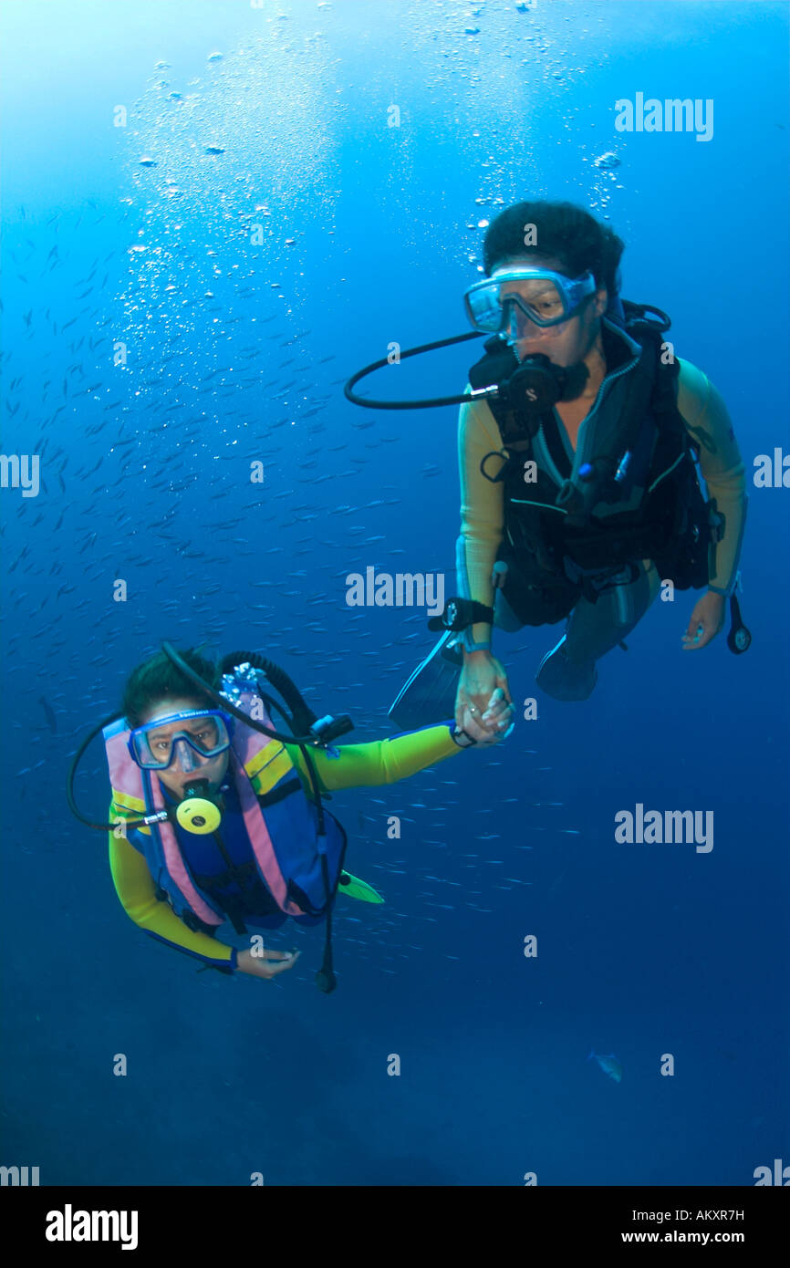 Mother an daughter are diving, Maldives. Stock Photo