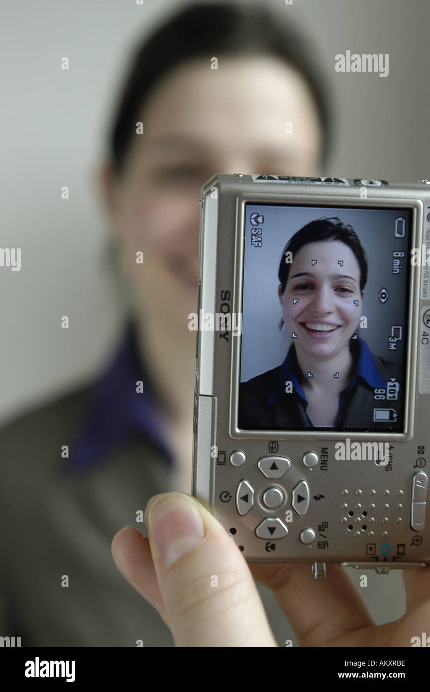 A person taking a digital photograph of a woman Stock Photo Alamy