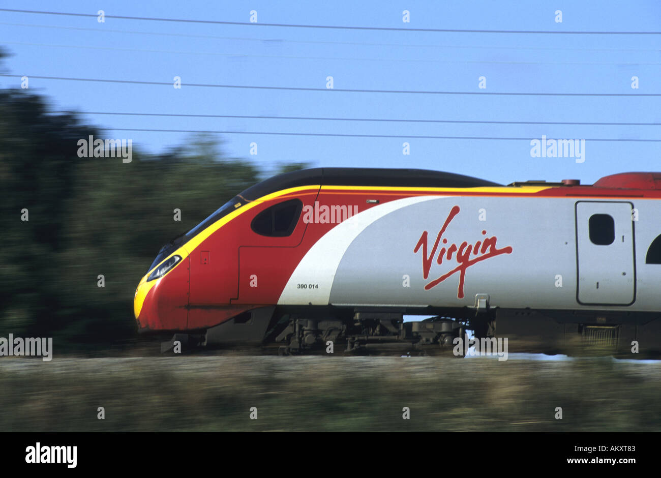Virgin Pendolino train at speed on West Coast Main Line, Northamptonshire, England, UK Stock Photo