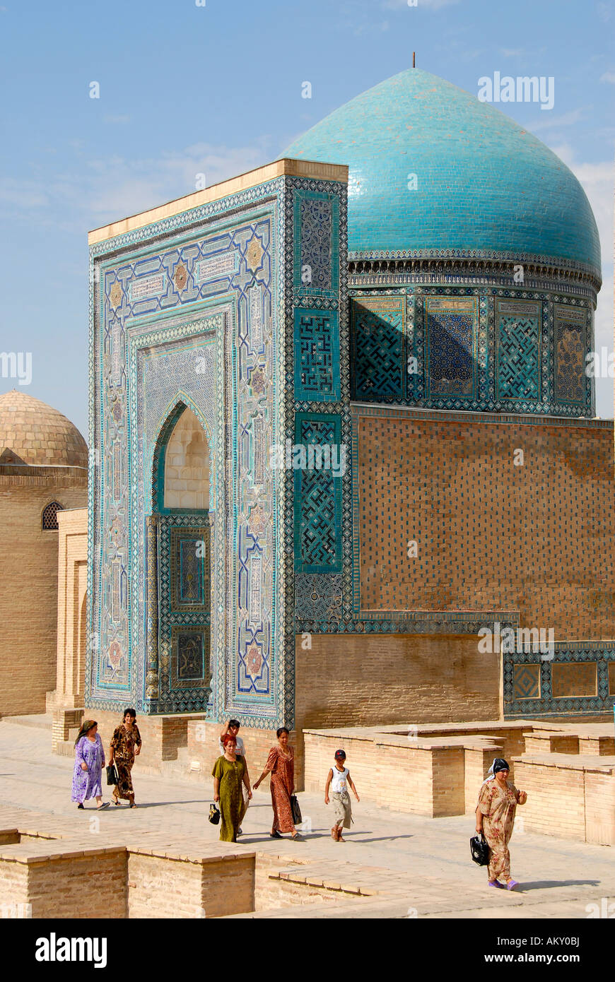 Believers at blue decorated mausoleum necropolis Shah-i-Zinda Samarkand Uzbekistan Stock Photo