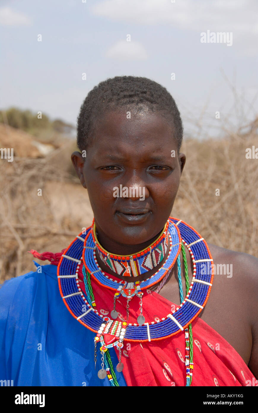 Masai woman shows colourful jewelry around her neck Amboseli National Park Kenya Stock Photo