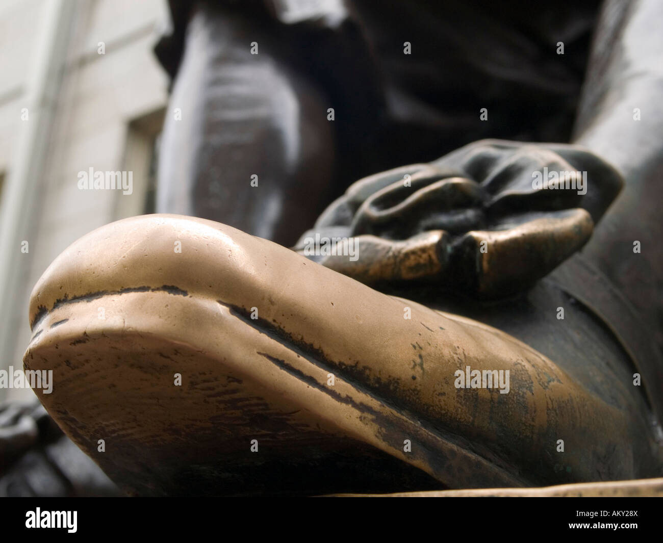 A close up of the 'lucky shoe' on the John Harvard statue, Harvard ...