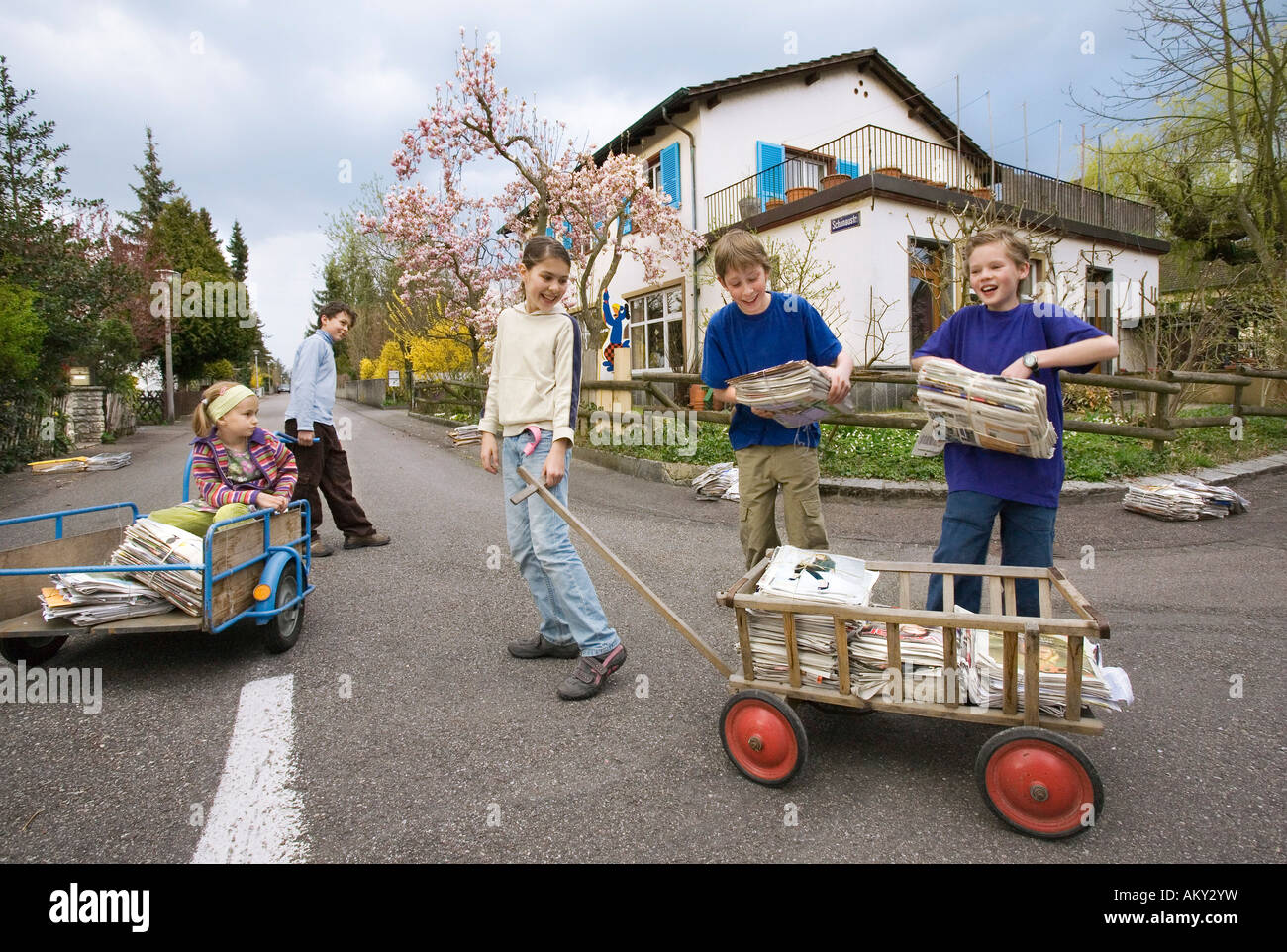 Pupils collecting used paper for the central recyling station, Muenchenstein, Basel, Switzerland Stock Photo