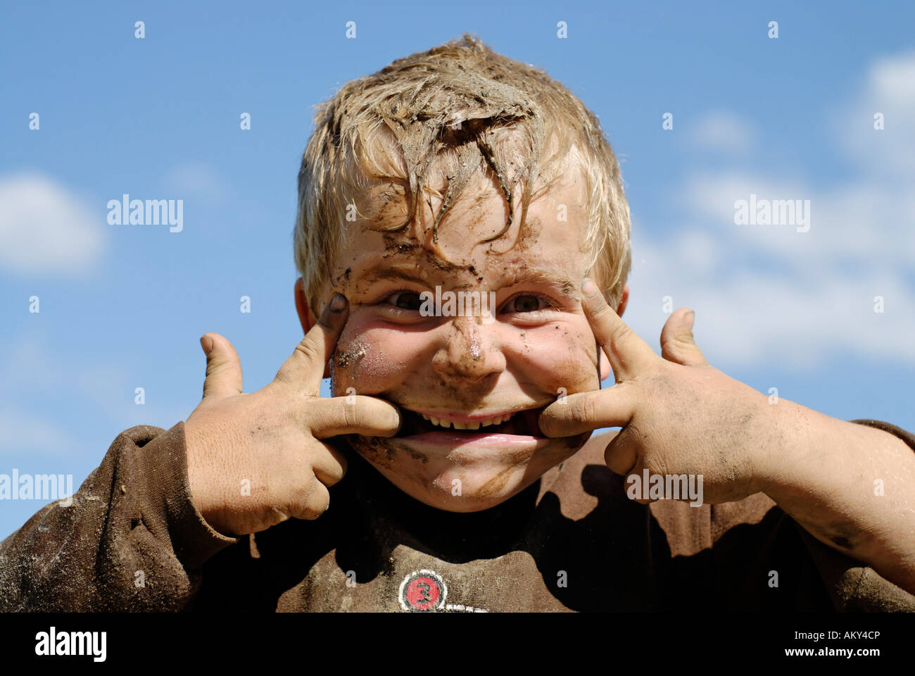 Boy covered with mud Stock Photo - Alamy