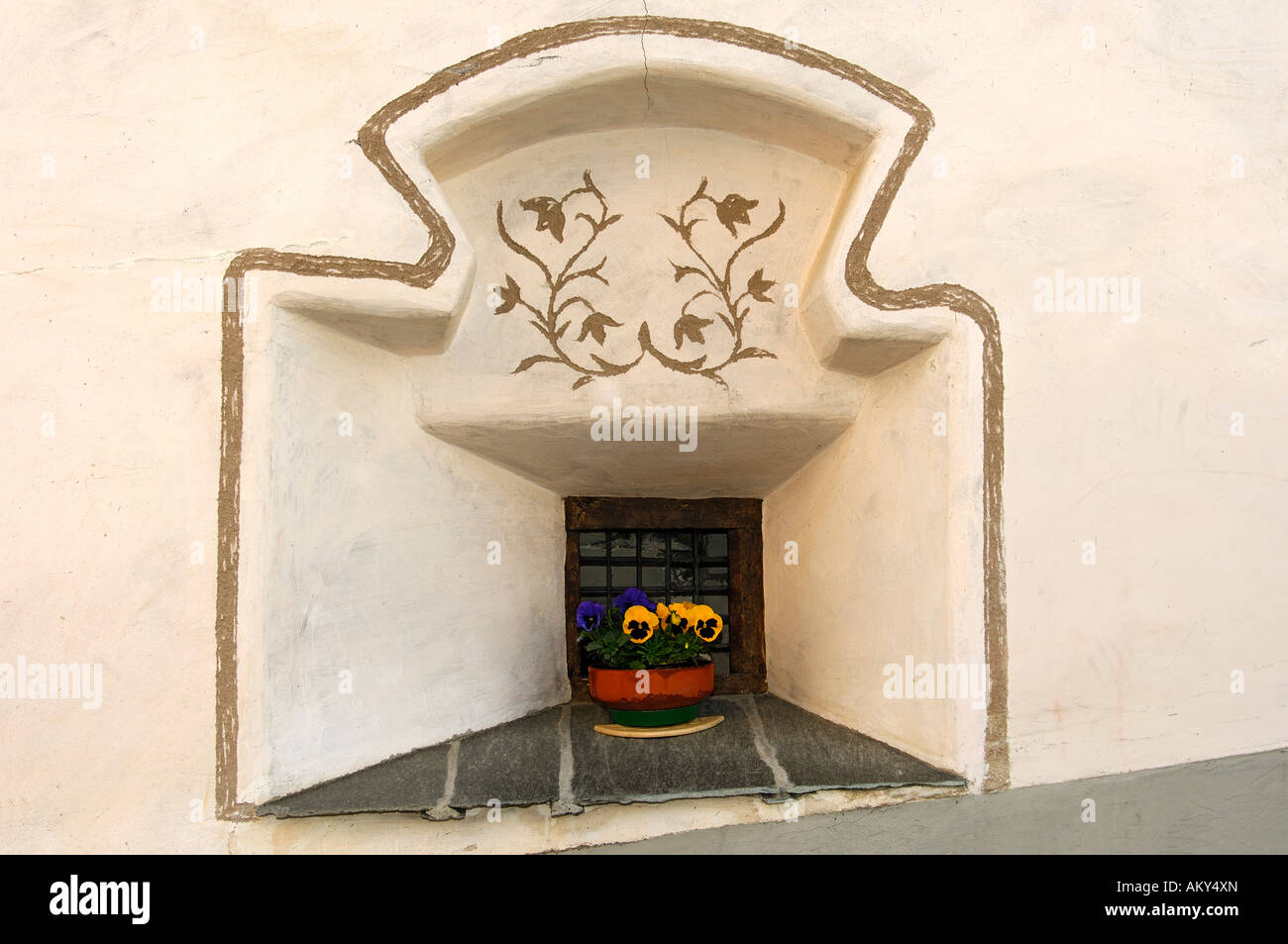 Window view of an Engadine house decorated with Sgraffito ornaments, Samedan, Engadin, Grisons, Switzerland Stock Photo