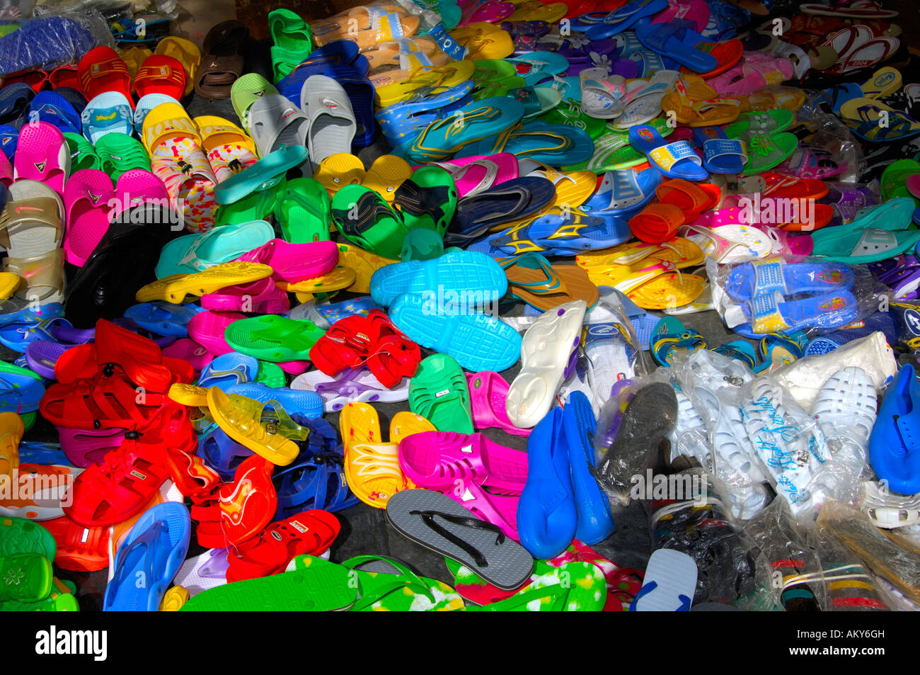 Imported cheap plastic shoes for sale on a local market, Burkina Faso Stock Photo