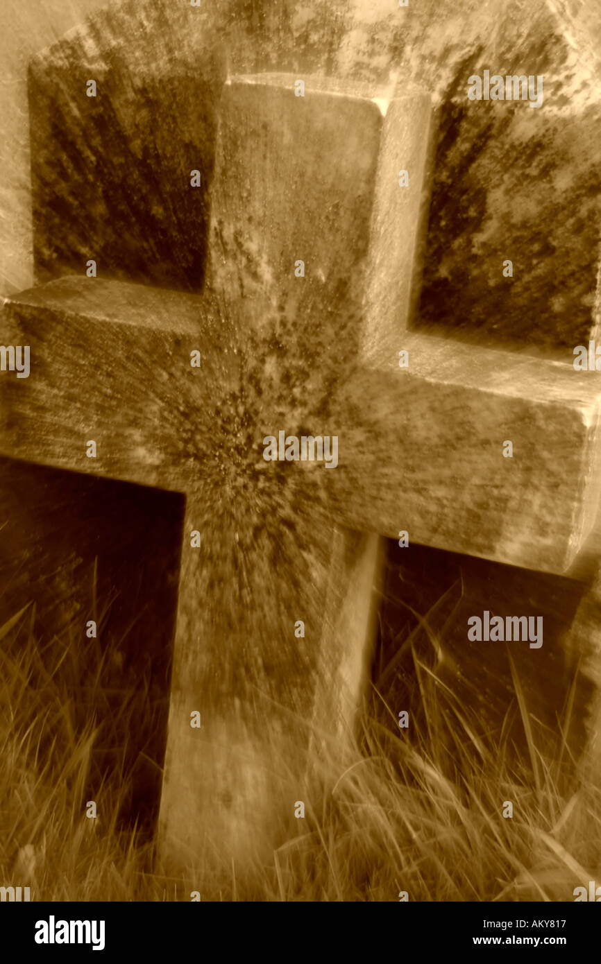 Cross in graveyard Sepia tone Stock Photo