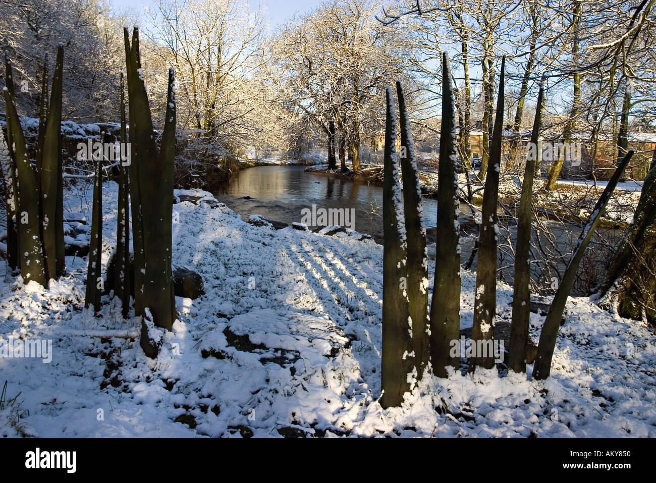 Wooden sculptures representing blades of grass by the River Tame at