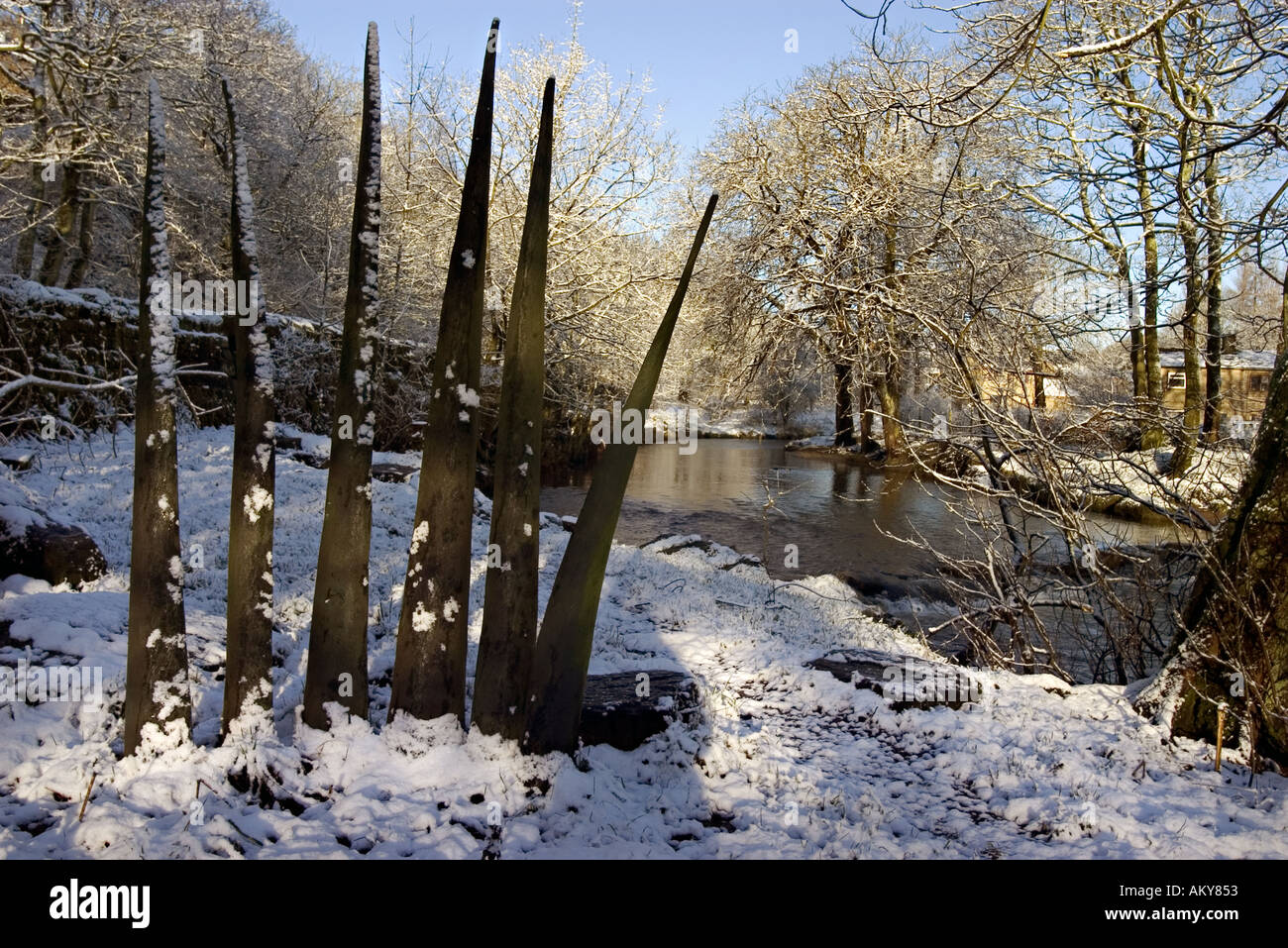 Wooden sculptures representing blades of grass by the River Tame at