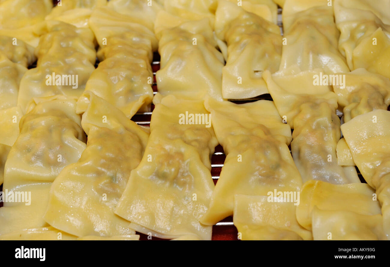 Swabian pockets (cook.) or ravioli (Pasta squares filled with meat and spinach) Stock Photo