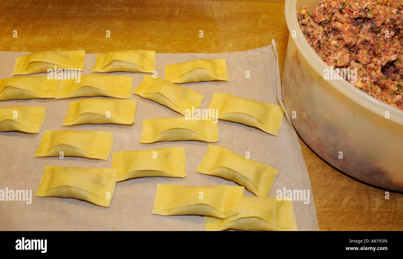 Swabian pockets (cook.) or ravioli (Pasta squares filled with meat and spinach) Stock Photo