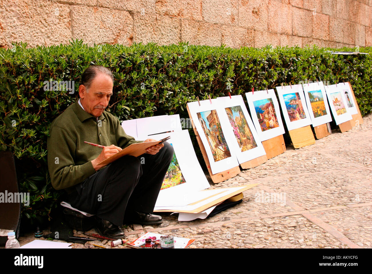 Artist with paintings displayed for sale in the old town of Palma de Mallorca, Majorca, Spain, Europe Stock Photo