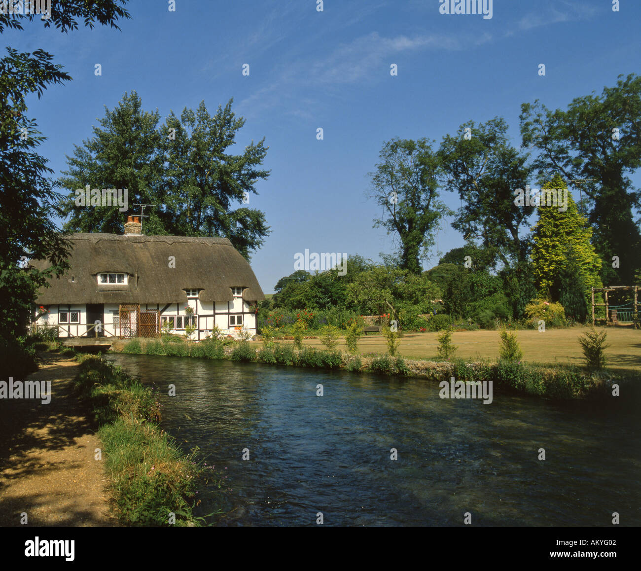 Fullerton Mill. 13th Century watermill on river Arle at New Arlesford Hampshire England August Stock Photo