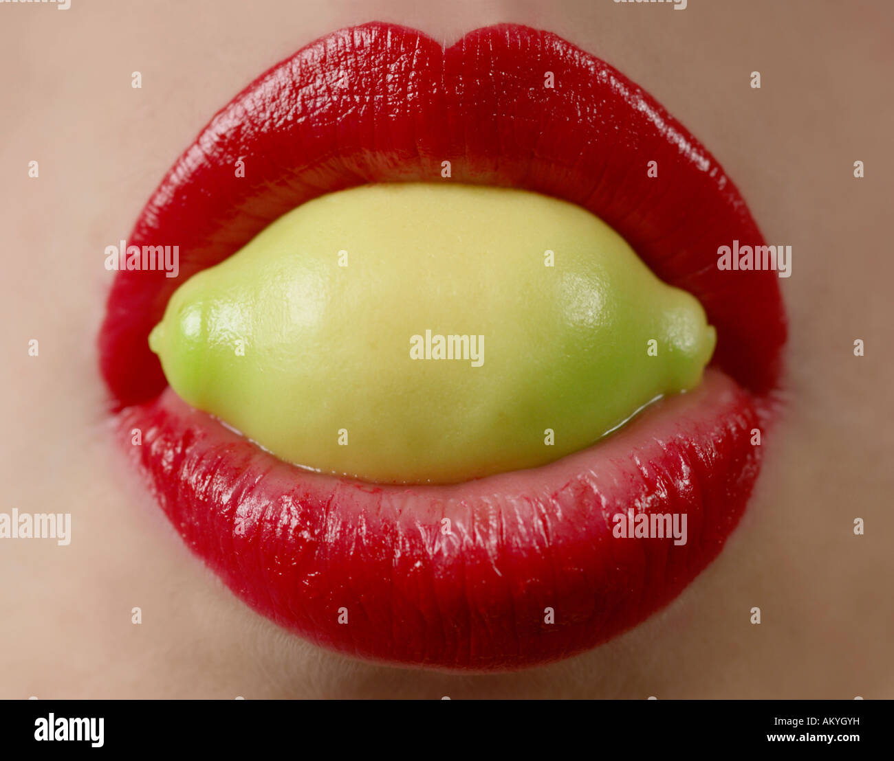 Lemon in the mouth Stock Photo Alamy