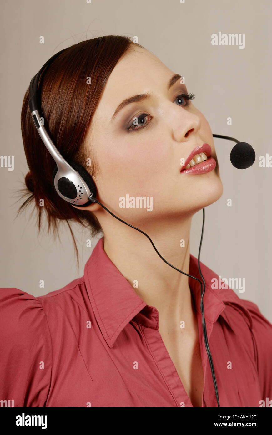 Young woman with headset, call center, telephone operator Stock Photo