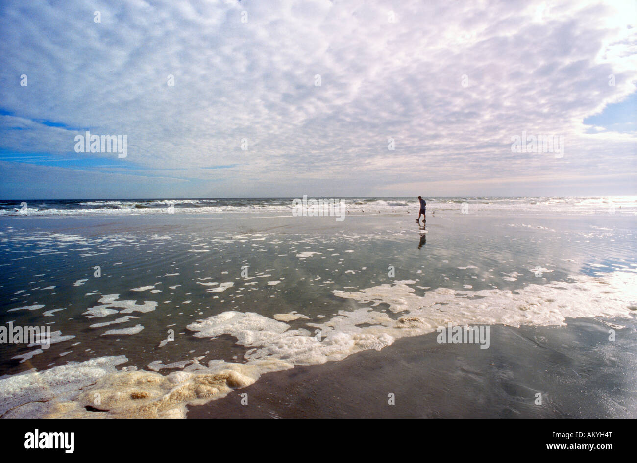 Man walking on beach slow hi-res stock photography and images - Alamy