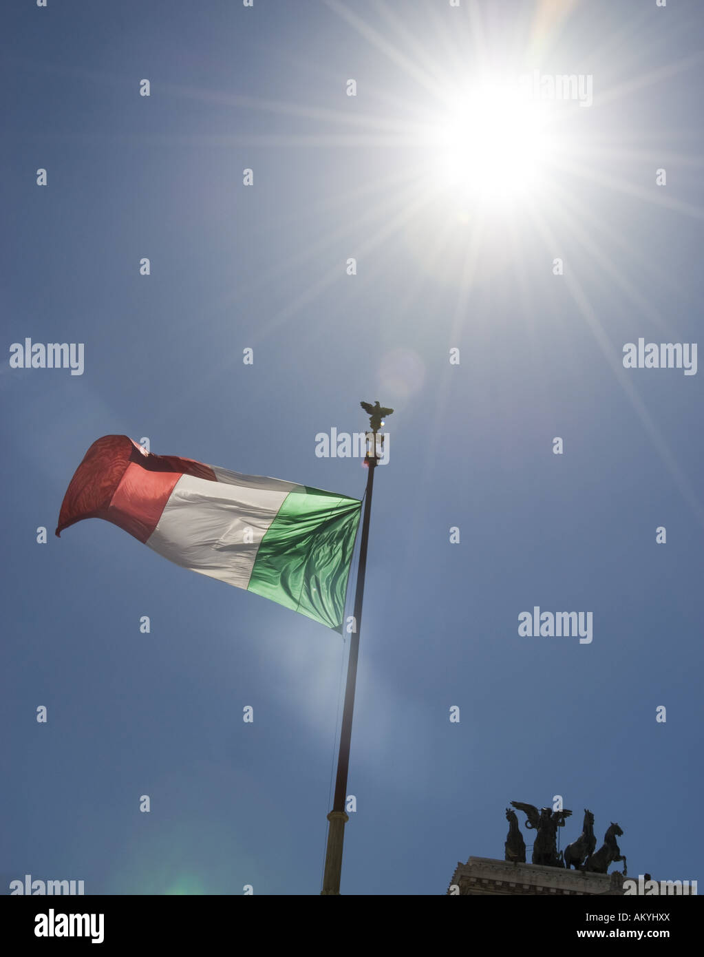 Vittorio Emanuele II. Monument, Italian flag and Quadriga in the sunlight, Rome, Italy. Stock Photo