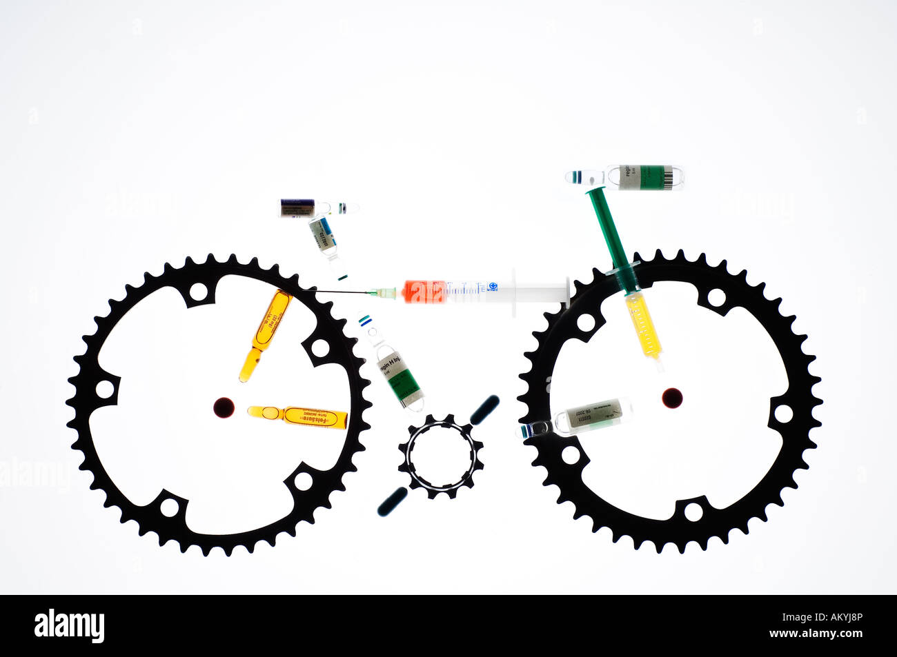 Gear wheels and medicines symbolize medicine abuse (doping) in the cycling. Stock Photo