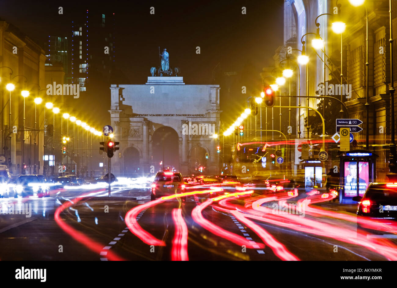 View over Ludwigstrasse towards Siegestor at night Munich Bavaria Germany Stock Photo