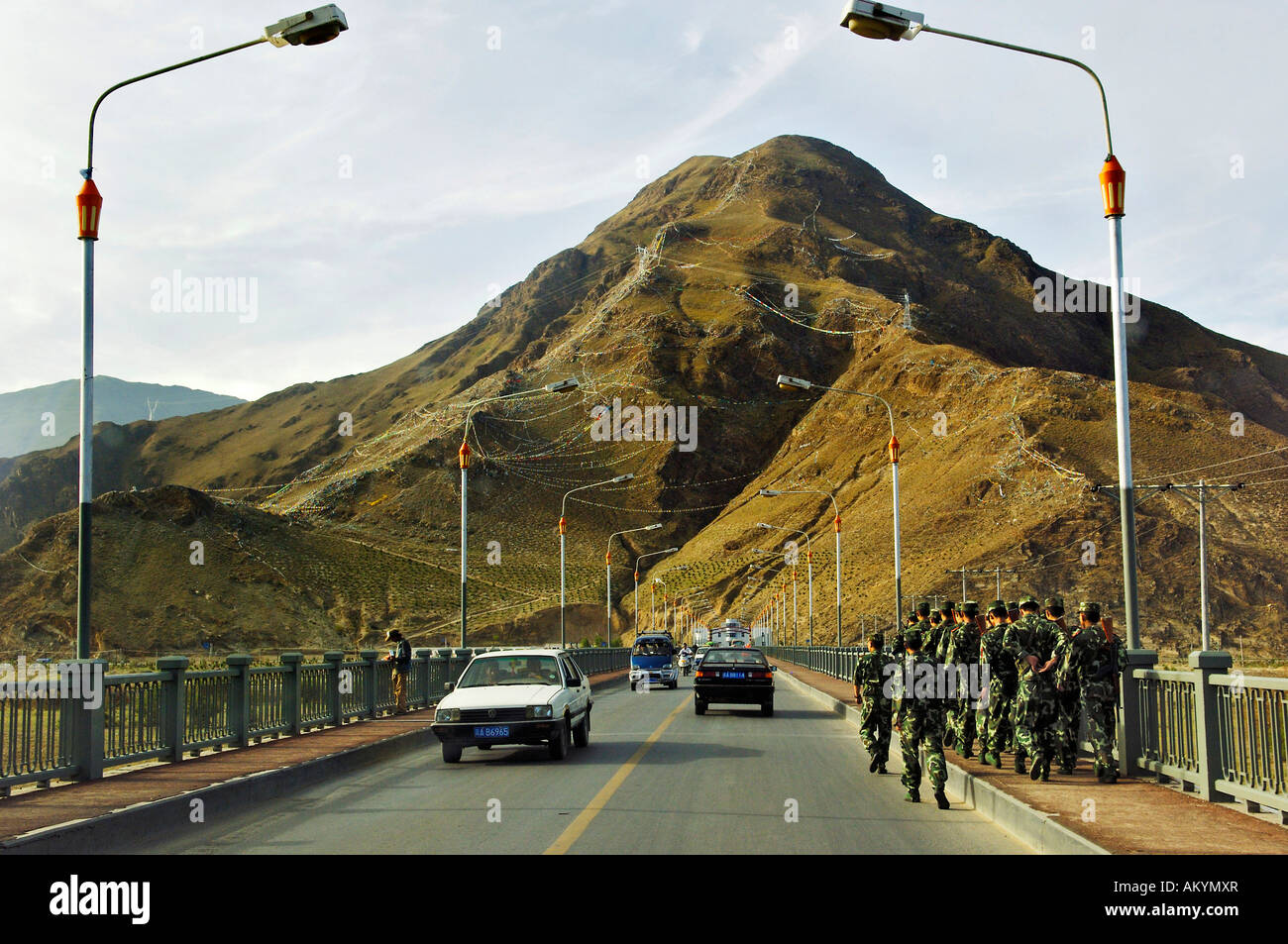 Chinese soldiers passng a bridge near Llasa, Tibet Stock Photo