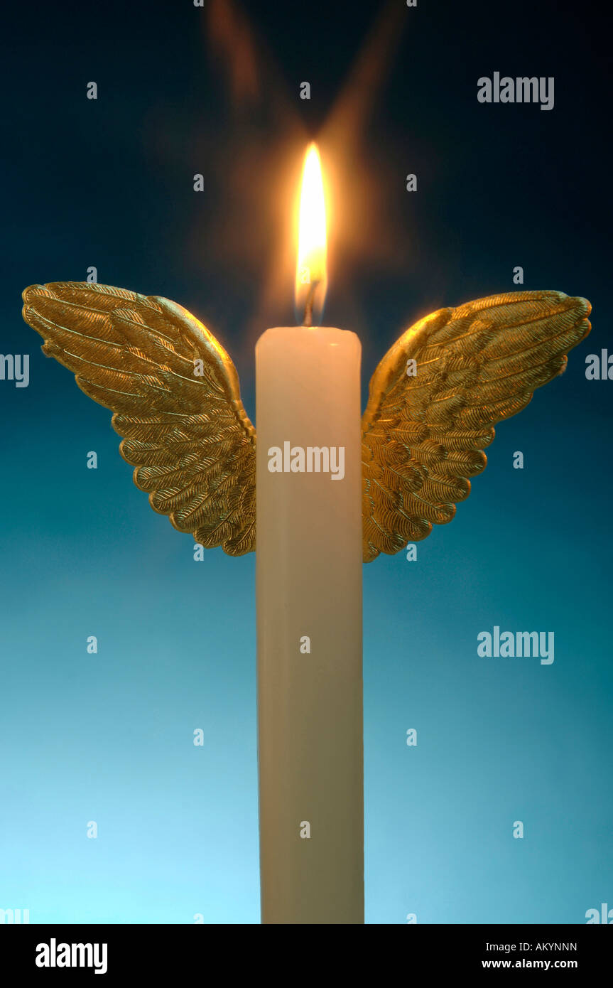 Burning candle and angle´s wings Stock Photo Alamy