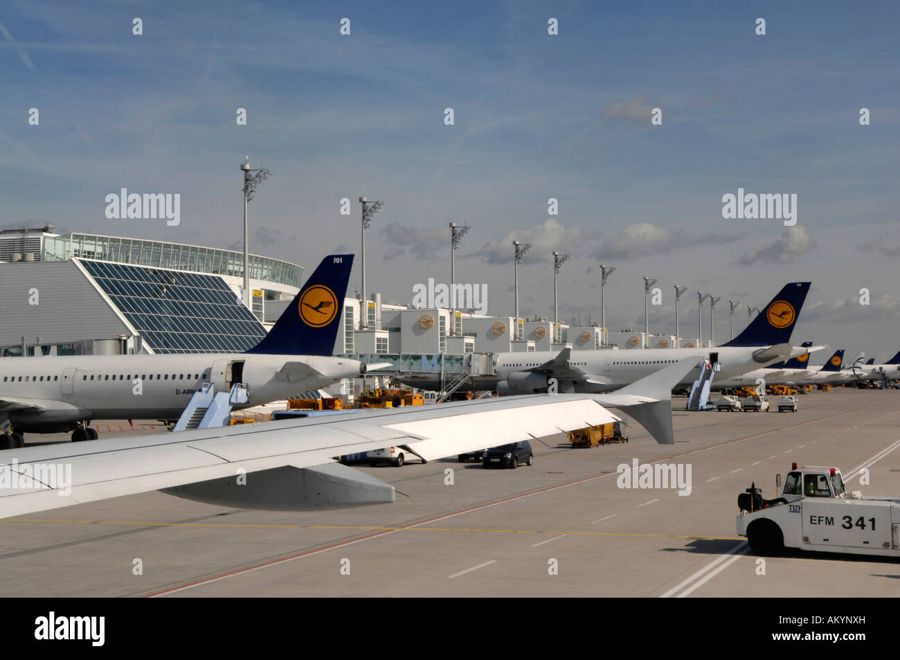 Landing strip with airplanes getting loaded, Munich Airport, Bavaria
