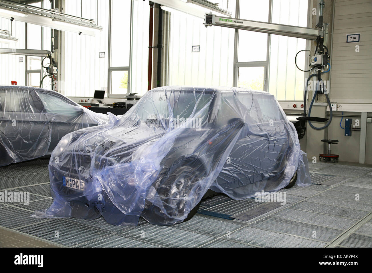 Garage: BMW Mini covered by tarpaulin Stock Photo