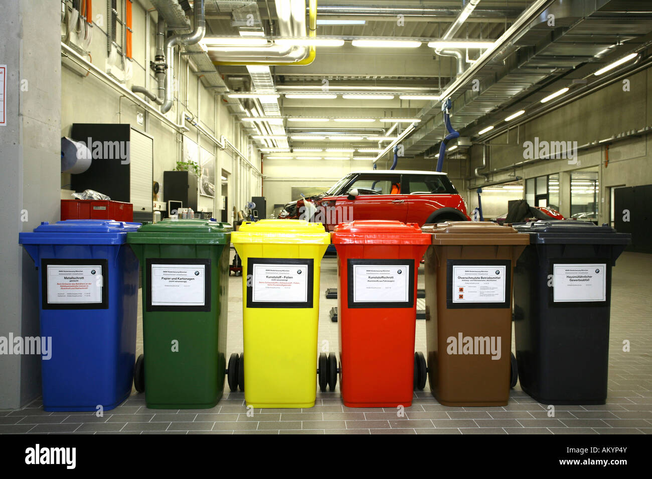 Recycling containers in a garage Stock Photo