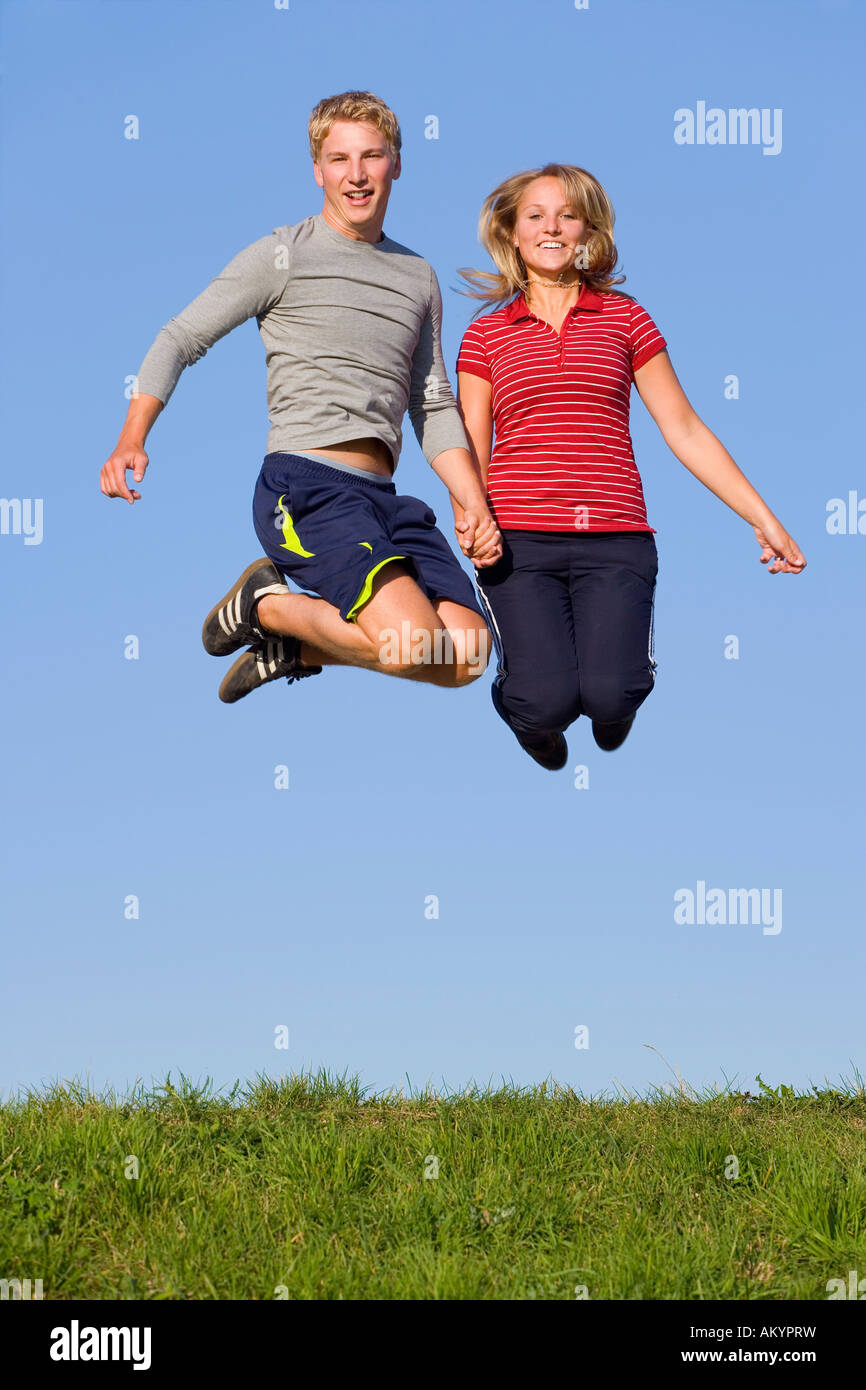 A young couple jumping high Stock Photo